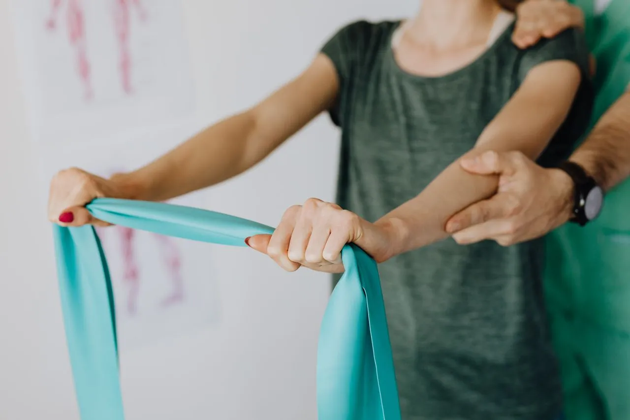 Patient performing a shoulder exercise with a resistance band
